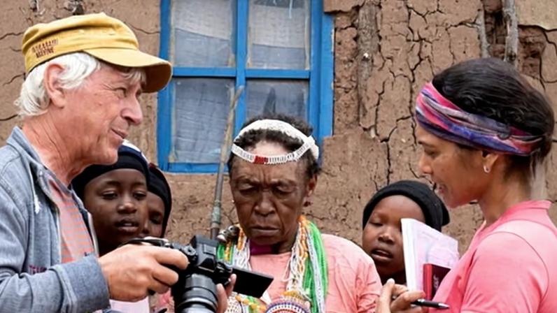 Sheena Shah and Matthias Brenzinger discuss their recording of Mathabang Hlaela speaking in the endangered language of siPhuthi with her as young girls watch, in the village of Ha Sekhobe in Daliwe valley. Photograph: Kate Ochsman/The Guardian