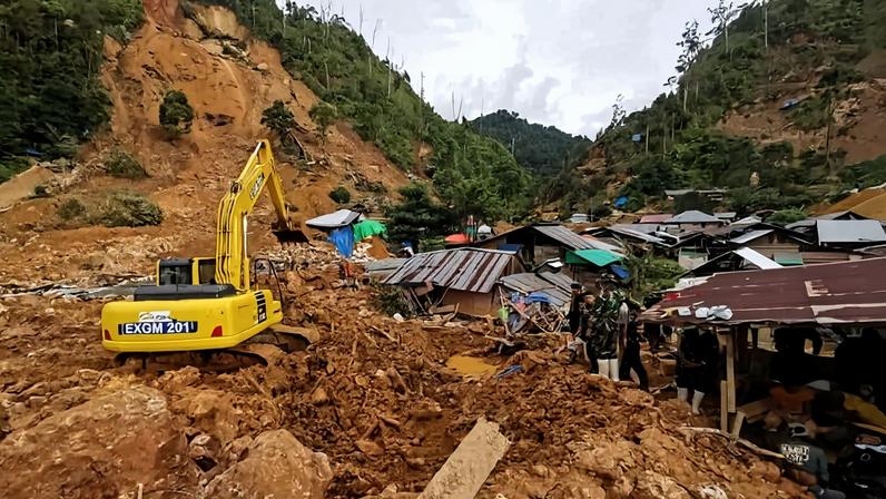 Rescuers search for victims at the site of a landslide in Suwawa on Sulawesi Island in July 2024. Image by AP Photo/Basarnas.