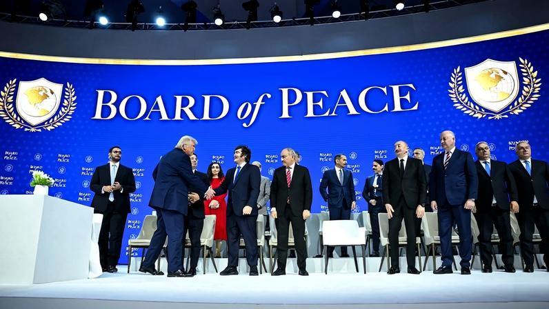 U.S. President Donald Trump shakes hands with Argentine President Javier Milei at the “Board of Peace” charter signing ceremony during the World Economic Forum in Davos, Switzerland, on Jan. 22.