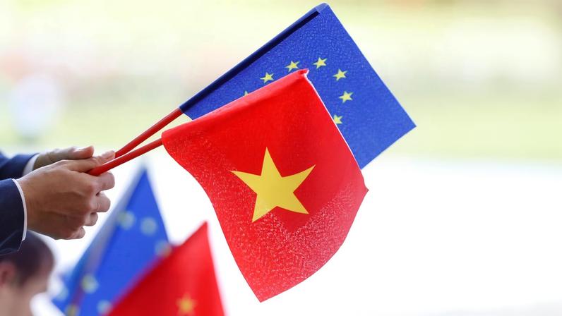 European Union and Vietnamese flags are seen at the signing ceremony of EU-Vietnam Free Trade Agreement at the government office in Hanoi