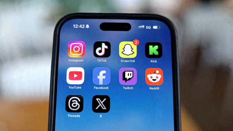 Social media apps are displayed on a mobile phone