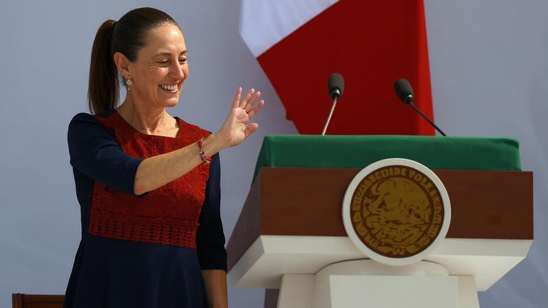 Mexico's President Claudia Sheinbaum waves during an event in Zocalo Square to commemorate 7 years since her party, Morena, came to power, in Mexico City, Mexico December 6, 2025. REUTERS/Raquel Cunha/File Photo