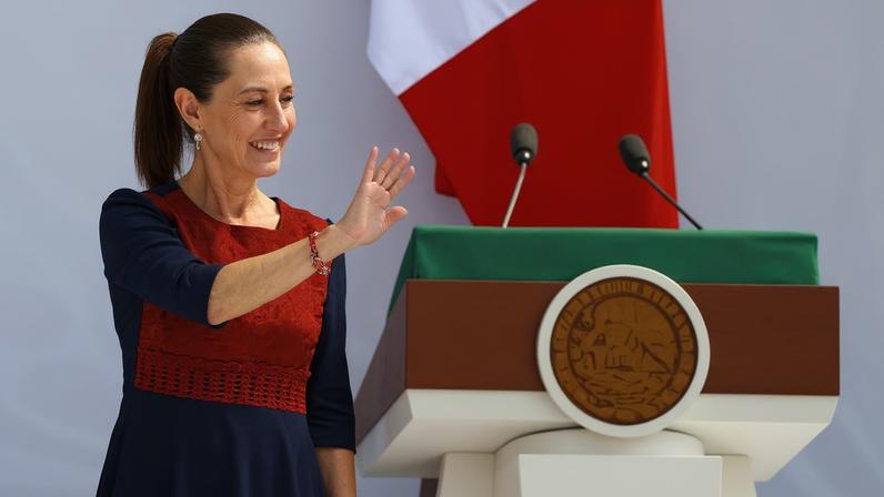 Mexico's President Claudia Sheinbaum waves during an event in Zocalo Square to commemorate 7 years since her party, Morena, came to power, in Mexico City, Mexico December 6, 2025. REUTERS/Raquel Cunha