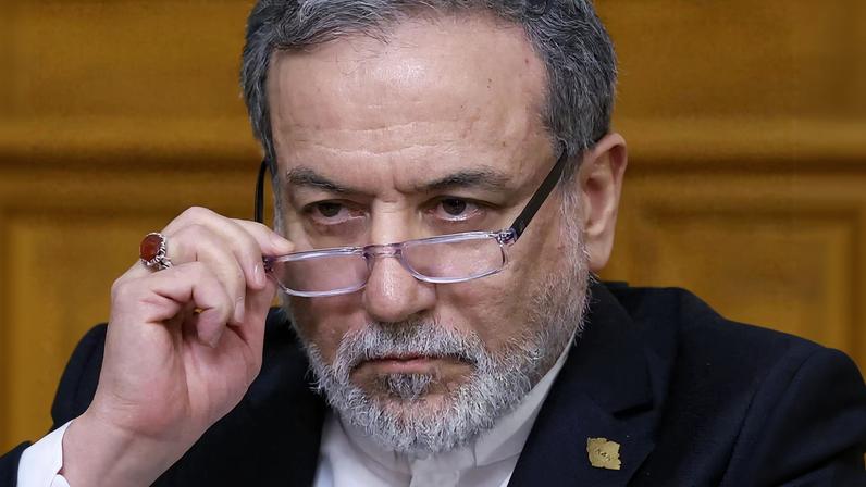 Iranian Foreign Minister Abbas Araqchi adjusts glasses during a press conference following talks with Russian Foreign Minister Sergei Lavrov in Moscow, Russia, December 17, 2025. REUTERS/Ramil Sitdikov/Pool/File Photo