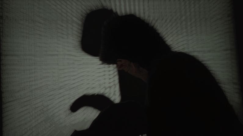 A hooded man holds a laptop computer as cyber code is projected on him in this illustration picture taken on May 13, 2017. REUTERS/Kacper Pempel/Illustration