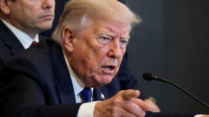 U.S. President Donald Trump points as he attends a meeting with oil industry executives, at the White House in Washington, D.C., U.S., January 9, 2026. REUTERS/Evelyn Hockstein/File Photo