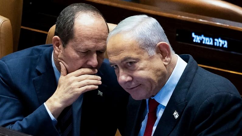 Israeli Economy Minister Nir Barkat, left, speaks with Prime Minister Benjamin Netanyahu at the Knesset in Jerusalem.