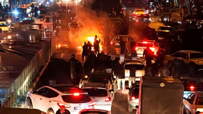 People gather during protest in Tehran.