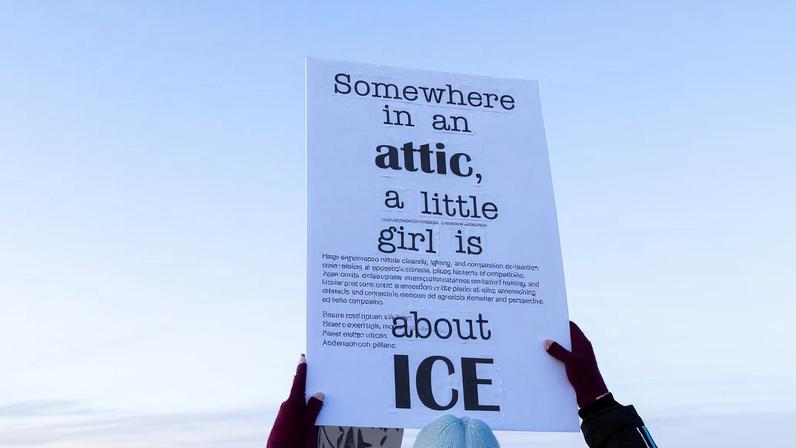 A person raises a sign in protest agains U.S. Customs Enforcement and Immigration (ICE) during a demonstration outside a dormant prison that is under contract to become an ICE detention center in Hudson, Colorado, U.S., January 21, 2026. REUTERS/Kevin Mohatt