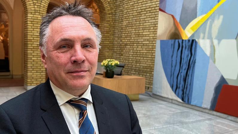 Norwegian Defence Minister Tore O. Sandvik poses for a picture at the Norwegian Parliament in Oslo