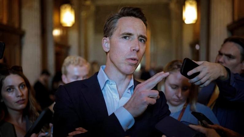 U.S. Sen. Josh Hawley speaks to a group of reporters outside of the Senate chamber in the U.S. Capitol.