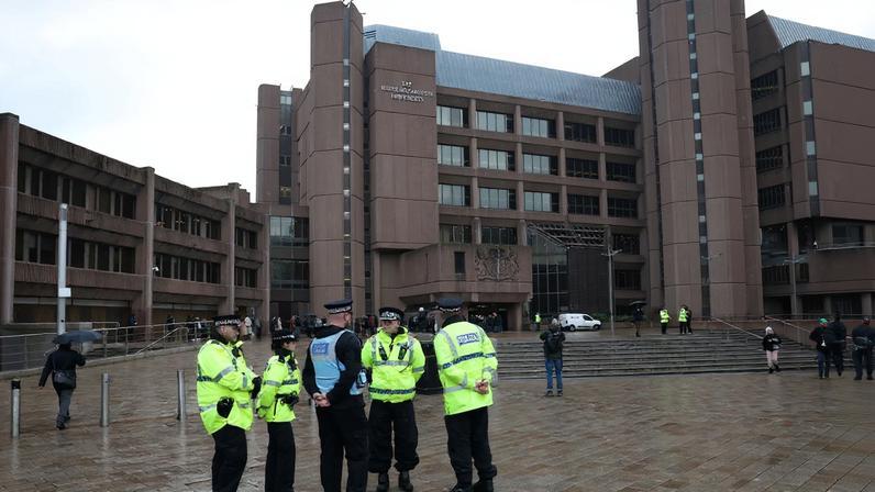Police officers stand outside Liverpool Crown Court at the start of the trial of Axel Rudakubana, in Liverpool, Britain, January 20, 2025. REUTERS/Phil Noble