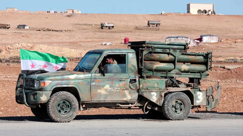 A military vehicle of the Syrian army is parked on the highway near Tabqa, after the Syrian army took control of it, Syria, January 19, 2026. REUTERS/Mahmoud Hassano