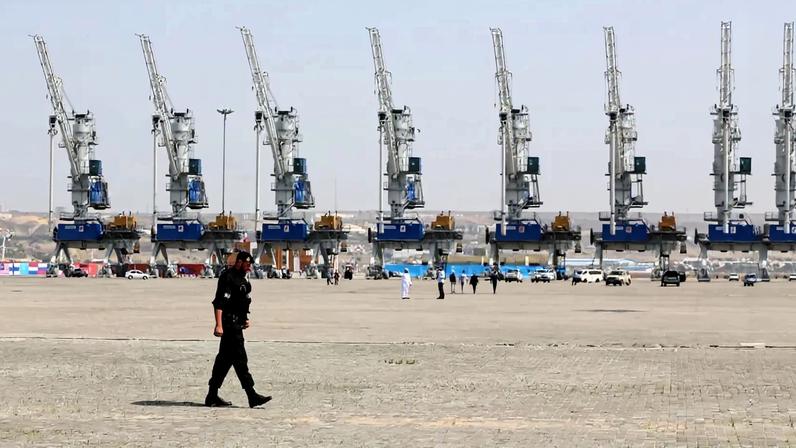 A police officer walks during an inauguration ceremony of new equipment and infrastructure at Shahid Beheshti Port in Chabahar, Iran.