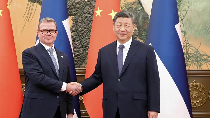 Chinese President Xi Jinping and Finland's Prime Minister Petteri Orpo shake hands at the Great Hall of the People in Beijing, China January 27, 2026. China Daily via REUTERS