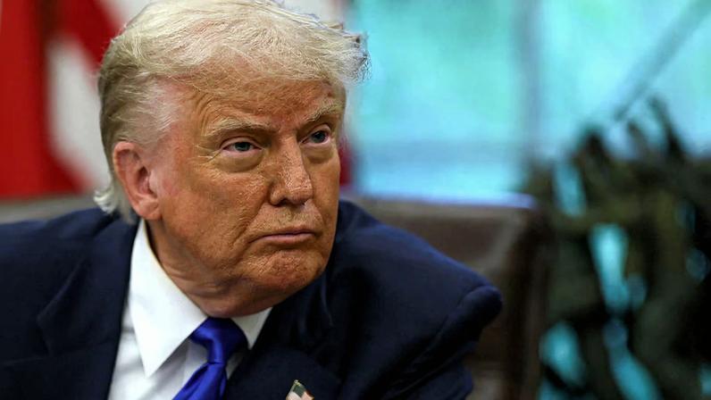 U.S. President Donald Trump looks on as he signs executive orders and proclamations in the Oval Office at the White House, in Washington, D.C., U.S., May 5, 2025. REUTERS/Leah Millis/File Photo