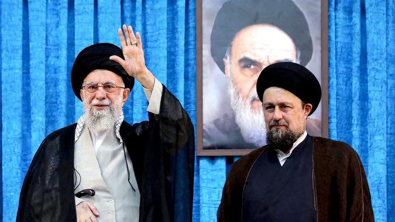 Ayatollah Ruhollah Khomeini's grandson, Hassan Khomeini stands next to Iran's Supreme Leader Ayatollah Ali Khamenei during the 36th anniversary of the death of the leader of Iran's 1979 Islamic Revolution, Ayatollah Ruhollah Khomeini, at Khomeini's shrine in southern Tehran, Iran June 4, 2025.