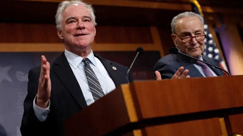 U.S. Sen. Tim Kaine (left) speaks alongside Senate Minority Leader Charles Schumer at a press conference at the U.S. Capitol in Washington on April 2, 2025.