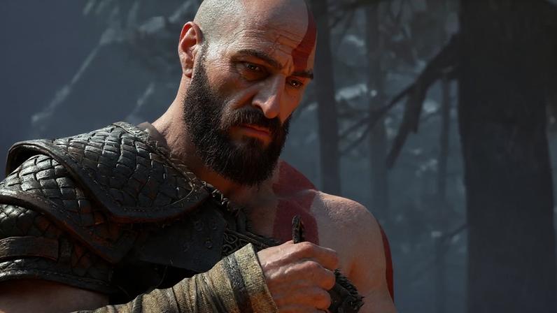 Kratos stares in sadness.
