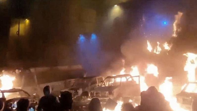 Protesters gather as vehicles burn, amid evolving anti-government unrest, in Tehran, Iran, in this screen grab obtained from a social media video released on January 9, 2026. Social Media/via REUTERS/File Photo