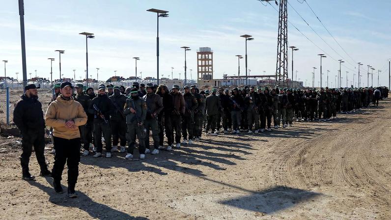Members of the Syrian government security forces gather after they took control of al-Hol camp following the withdrawal of Syrian Democratic Forces (SDF), in Hasaka, Syria, January 21, 2026. REUTERS/Khalil Ashawi