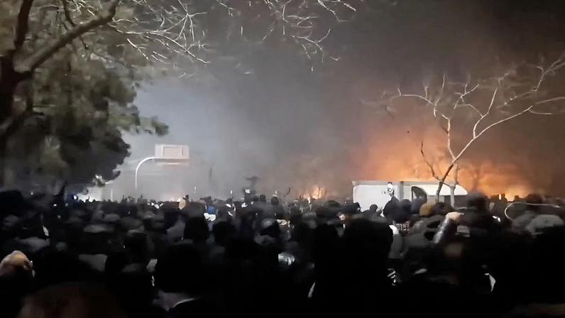 Smoke rises as protesters gather amid evolving anti-government unrest at Vakilabad highway in Mashhad, Razavi Khorasan province, Iran, released on January 10, 2026, in this social media video.