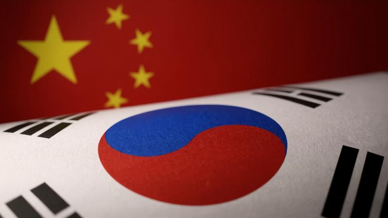 Printed Chinese and South Korean flags are seen in this illustration, July 21, 2022. REUTERS/Dado Ruvic/Illustration