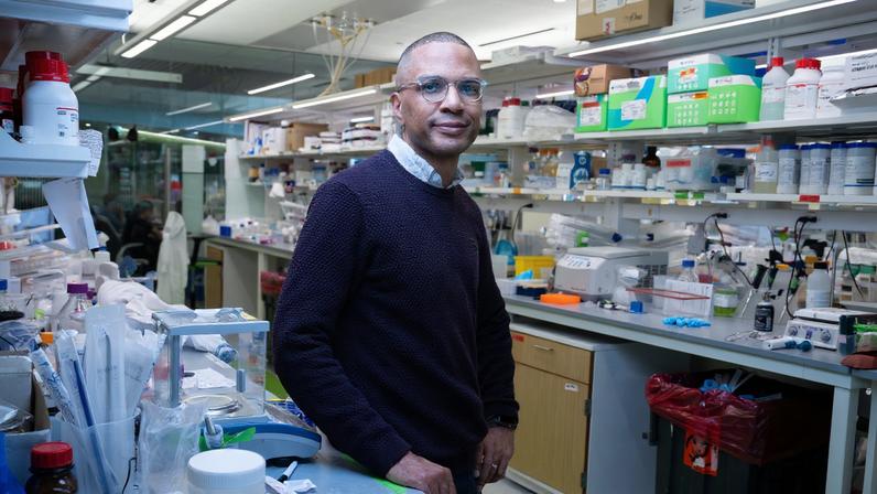 Bryan Bryson in cluttered lab