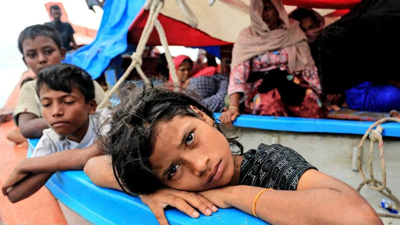 A Rohingya refugee child looks on as she is stranded due to a boat engine failure in the waters of South Aceh, Aceh province, Indonesia, October 20, 2024, in this photo taken by Antara Foto. Antara Foto/Syifa Yulinnas/via REUTERS