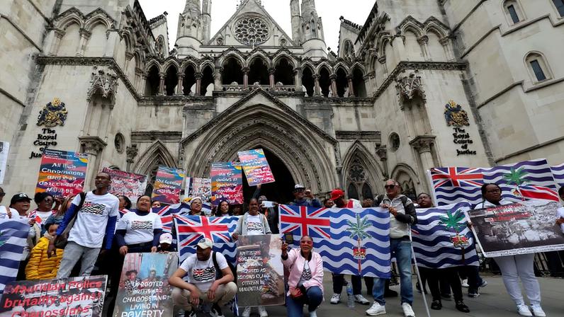 Members of the British Chagossian community demonstrate, as they wait to hear the outcome of a court injunction that temporarily blocked the UK from concluding Chagos Islands deal with Mauritius, outside the High Court in London, Britain, May 22, 2025. REUTERS/Suzanne Plunkett