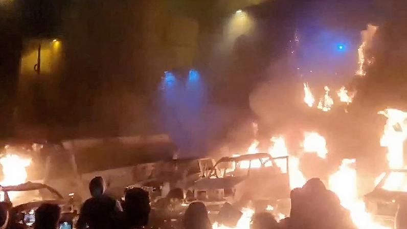 Protesters gather as vehicles burn, amid evolving anti-government unrest, in Tehran, Iran, in this screen grab obtained from a social media video released on January 9, 2026. Social Media/via REUTERS/File Photo