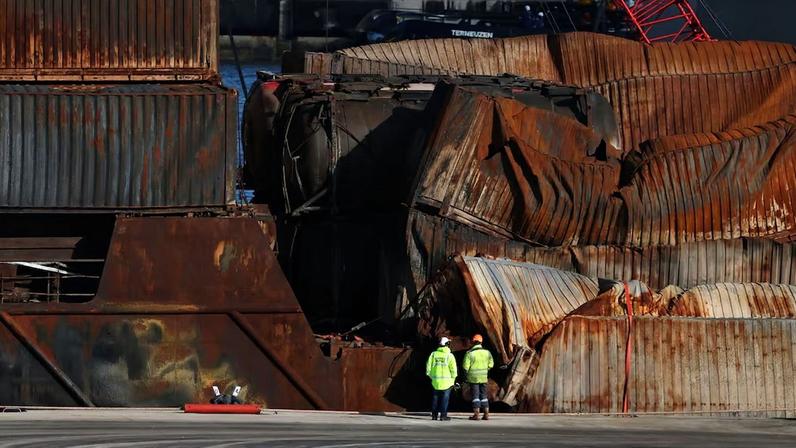 Salvage workers examine Solong container ship in Aberdeen