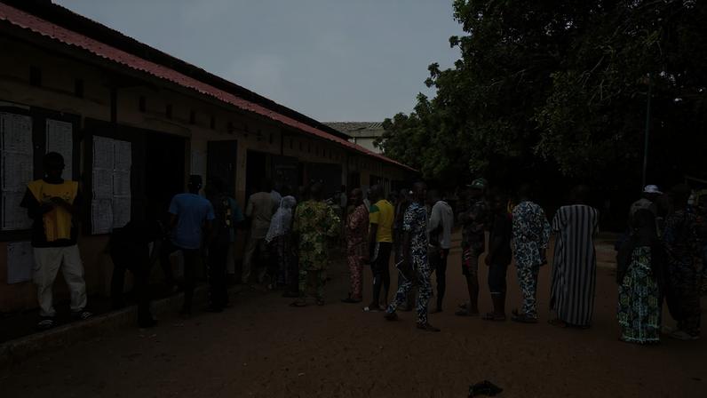 People wait in line to cast their vote at a polling station during the parliamentary election, in Cotonou, Benin, January 11, 2026. REUTERS/Charles Placide Tossou