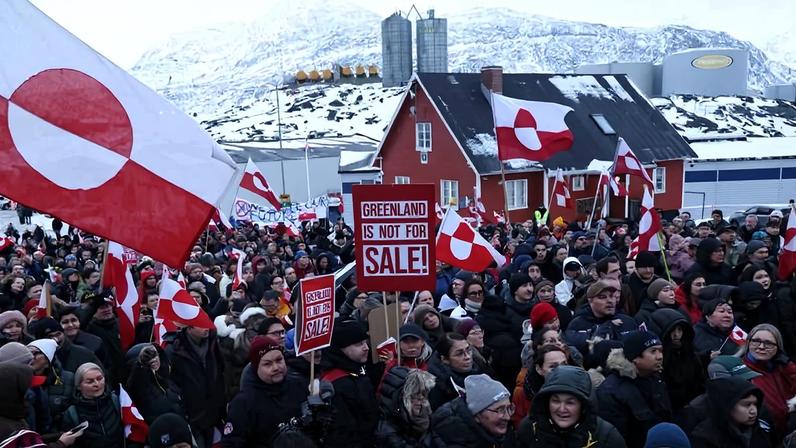 Protesters waving Greenlandic flags and placards gather outside the U.S. Consulate in Nuuk, Greenland, to express their opposition to U.S. President Donald Trump’s push to annex the Danish territory on Jan. 17.
