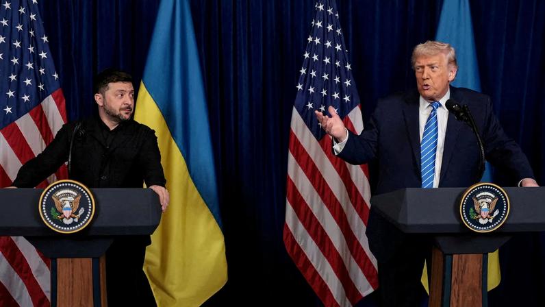 Ukrainian President Volodymyr Zelenskiy listens to U.S. President Donald Trump, after Trump said that Russian President Vladimir Putin expressed willingness to help Ukraine "succeed", during a press conference at Trump's Mar-a-Lago club, in Palm Beach, Florida, U.S., December 28, 2025. REUTERS/Jonathan Ernst/File Photo