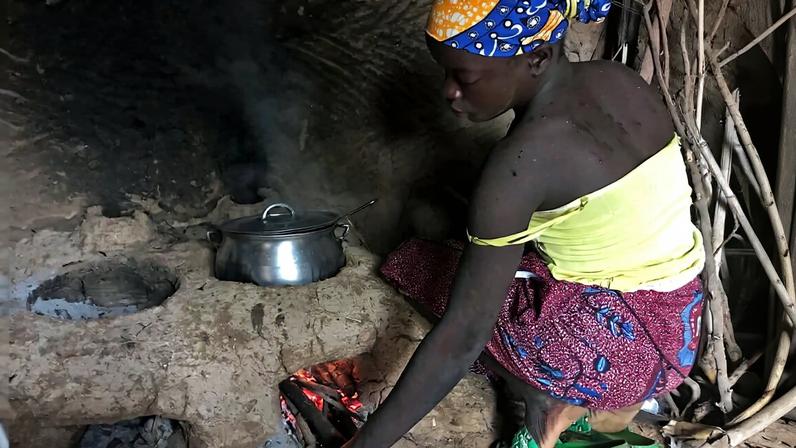 A woman uses a new cookstove in the village of Bang in the North region of Cameroon.