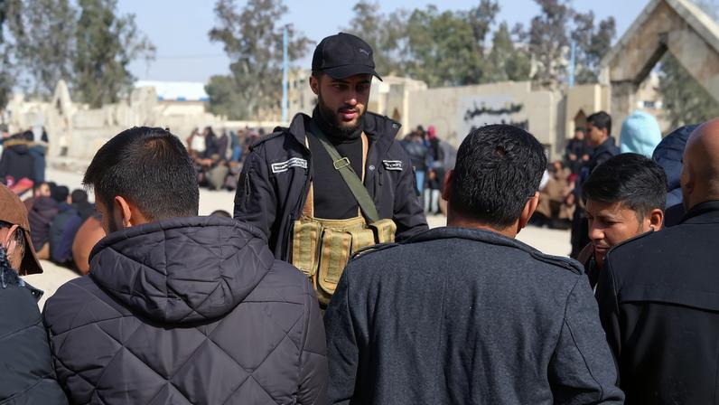 Members of the Kurdish-led Syrian Democratic Forces (SDF) queue to settle their status with Syrian government in Raqqa, Syria January 27, 2026.