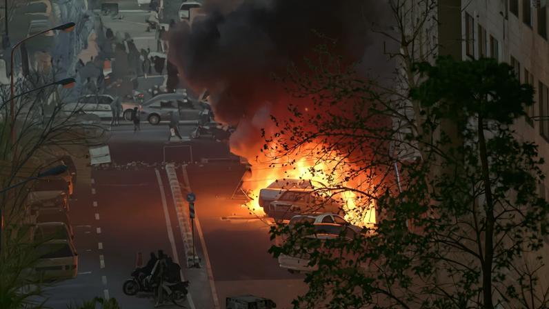 Cars burn in a street during a protest over the collapse of the currency's value, in Tehran, Iran, January 8, 2026. Stringer/WANA (West Asia News Agency) via REUTERS/ File Photo