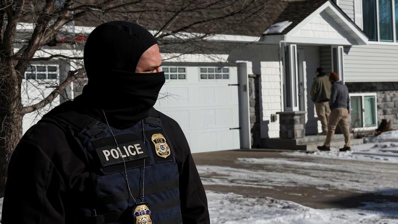 Federal agents with U.S. Immigration and Customs Enforcement (ICE) conduct an immigration enforcement operation in Pine Grove, Minnesota, U.S., January 28, 2026. REUTERS/Shannon Stapleton