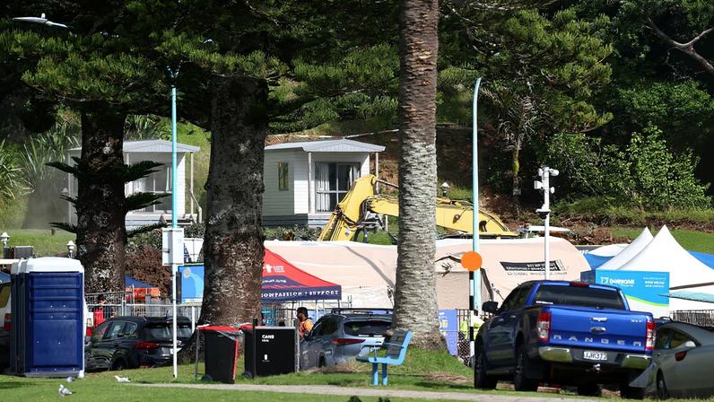 Emergency vehicles and heavy machinery at the scene of a landslide triggered by heavy rains on January 23, in Mount Maunganui, New Zealand, January 24, 2026. REUTERS/David Rowland