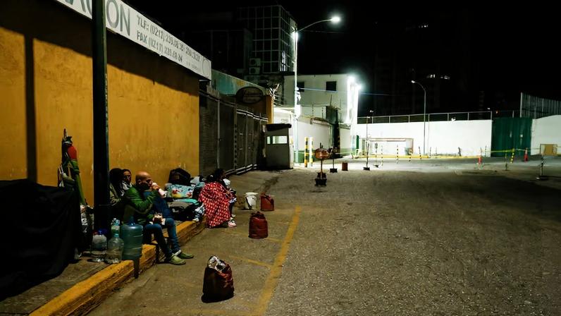 Family members of detainees wait outside the National Police Zone 7 Detention Centre, in Caracas