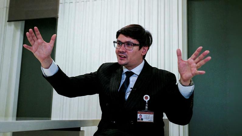 Chair of the House Committee on National Security, Border Affairs, National Strategy and National Reform and a member of the opposition People's Party, Rangsiman Rome, speaks during an interview with Reuters amid a mounting crackdown on scam centres operating along a porous border in Bangkok, Thailand February 26, 2025.