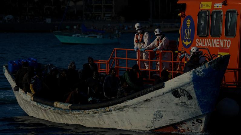 A Spanish Coast Guard vessel tows a fibreglass boat with migrants onboard to the port of Arguineguin, on the island of Gran Canaria, Spain, March 5, 2025. REUTERS/Borja Suarez/File Photo