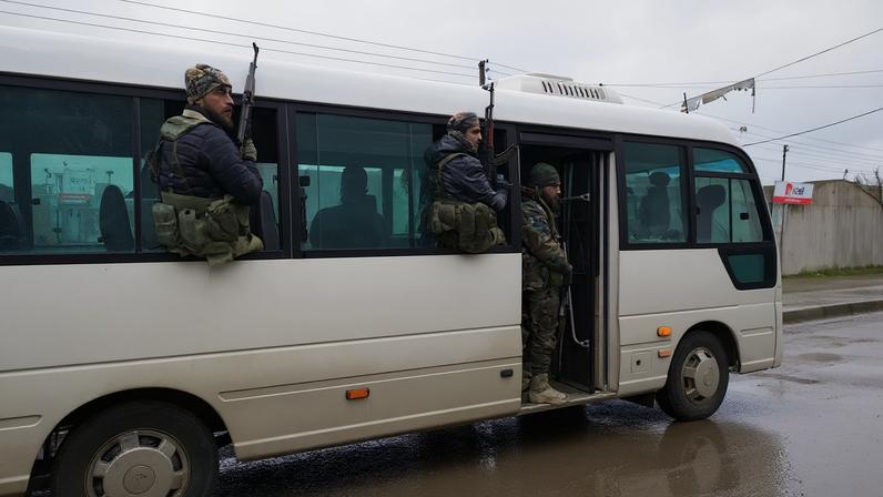 Members of the Syrian army are deployed inside the city of Tabqa after the withdrawal of the Syrian Democratic Forces (SDF)