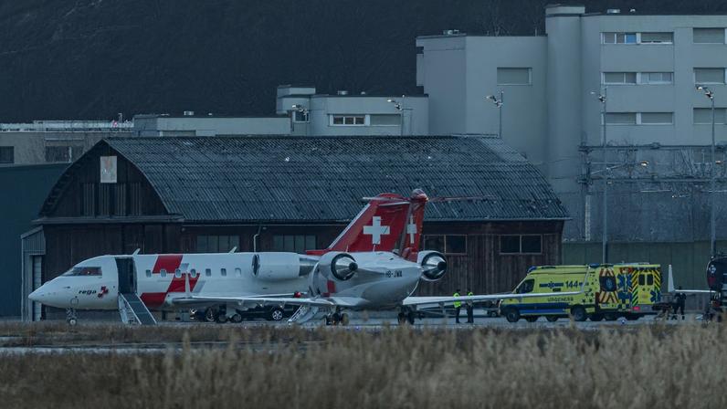 Swiss Rega Air-Ambulance planes and ambulances at the Sion airport following a fire and an explosion in the "Le Constellation" bar, during a New Year’s Eve party, according to Swiss police, in the upscale ski resort of Crans-Montana in southwestern Switzerland, in Sion, Switzerland, January 1, 2026. REUTERS/Pierre Albouy