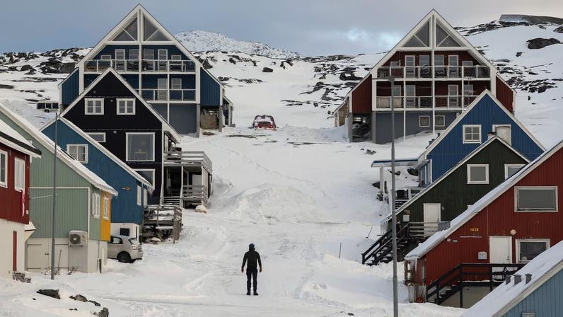 A man stands on a street on the day of the meeting between top U.S. officials and the foreign ministers of Denmark and Greenland, in Nuuk, Greenland, January 14, 2026. REUTERS/Marko Djurica/File Photo