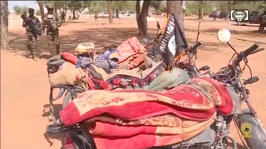 Members of the Nigerien army walk near the motorcycles seized from the attackers, following an attack on Niamey International Airport, in Niamey, Niger January 29, 2026, in this screengrab from a video. ORTN/Reuters TV/Handout via REUTERS