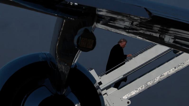 U.S. President Trump boards Air Force One, at Detroit Metropolitan Wayne County Airport, in Michigan, U.S., January 13, 2026. REUTERS/Evelyn Hockstein