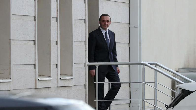 Former Georgian Prime Minister Irakli Garibashvili, charged with large-scale money laundering, leaves the courthouse after a hearing in Tbilisi, Georgia October 24, 2025. REUTERS/Irakli Gedenidze/File Photo