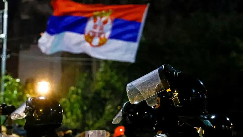 Serbian riot police face anti-government protesters in Belgrade on Aug. 14, 2025.
